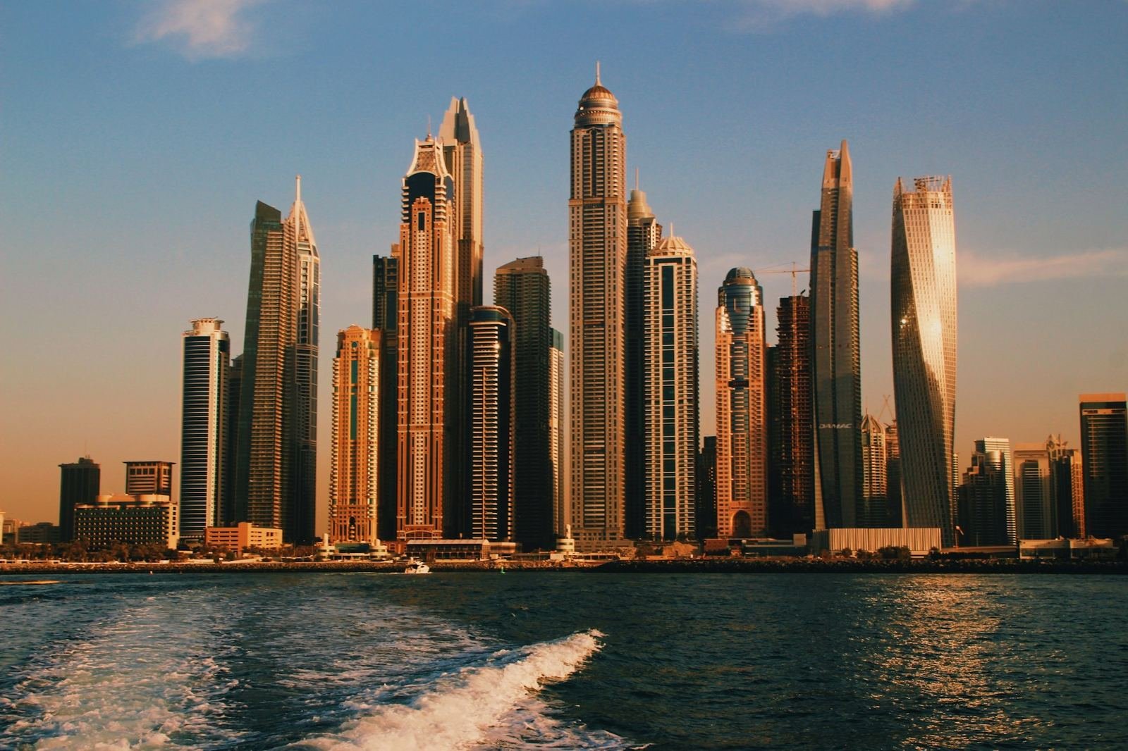 Luxury Dubai towers at dusk by the water