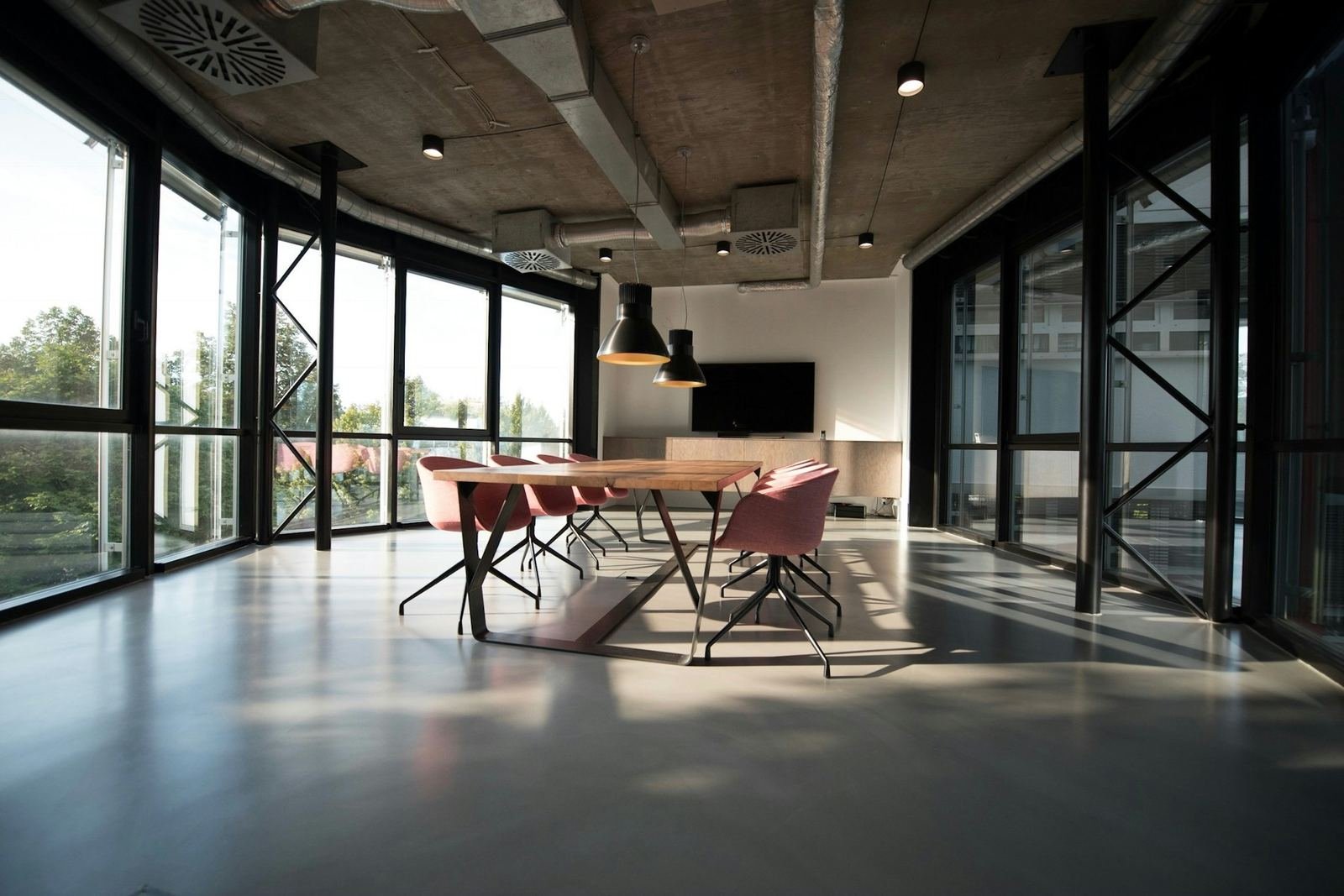 Bright serviced office lounge with armchairs